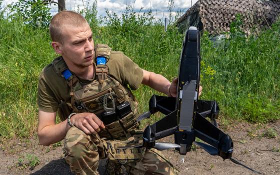 A Ukrainian serviceman of Khartia brigade launches an interceptor drone in Kharkiv region, Ukraine, June 26, 2026. (RNS/AP/Andrii Marienko)