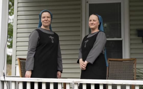 Sister Danielle Lussier, left, and Sister Theresa Aletheia pose for a portrait on the front porch of their home on April 27, 2026, in Mt. Sterling, Ky