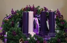 One purple candle is lit on an Advent wreath, the central symbolic rite of spiritual preparation for Christmas. Purple is the color of penitence and humility. The rose colored candle, lit the Third Week of Advent, represents a hopeful look toward Christ's coming. (OSV News/Bob Roller)